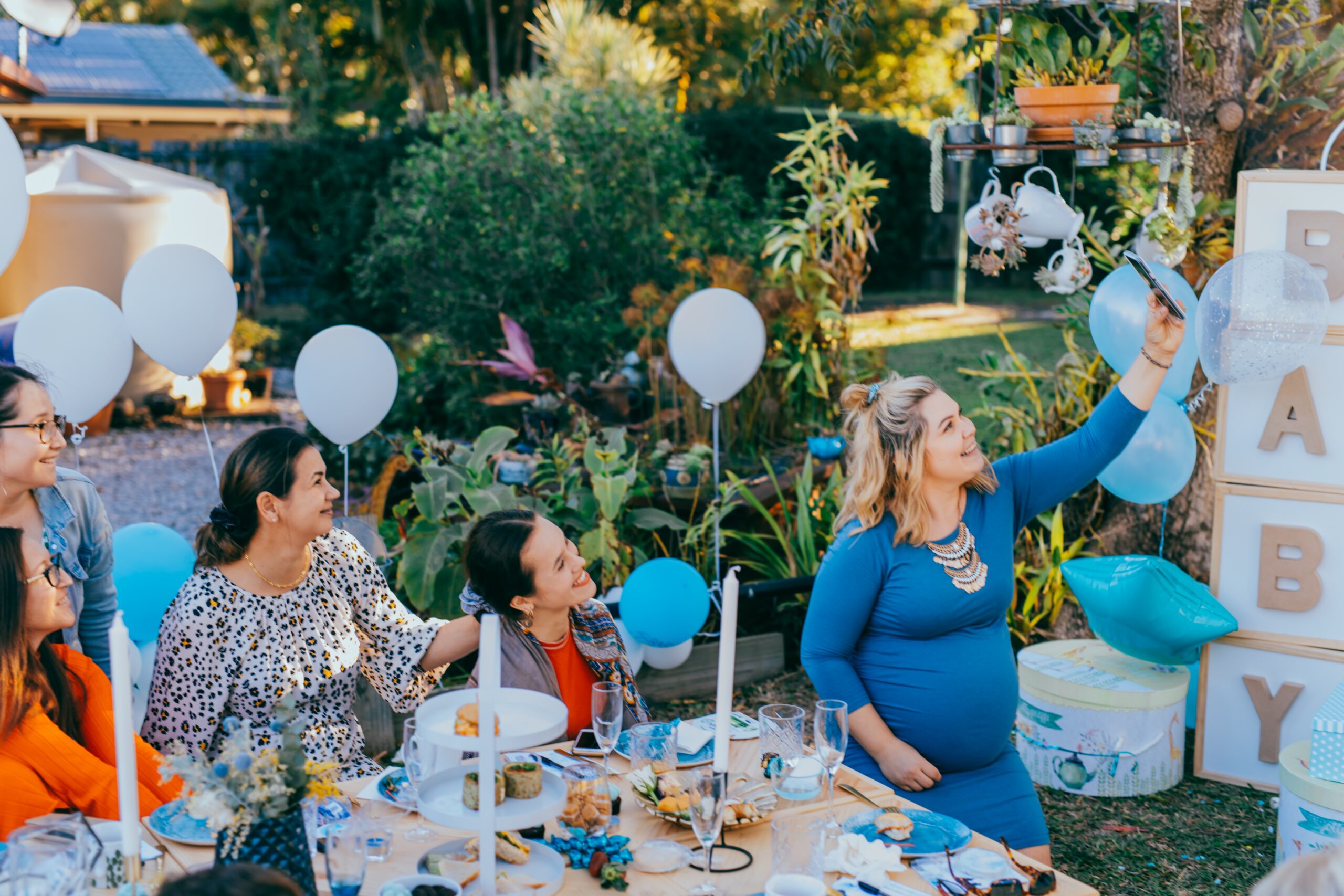 pregnant-woman-taking-selfie-photo-with-friends-on-2023-11-27-05-06-06-utc